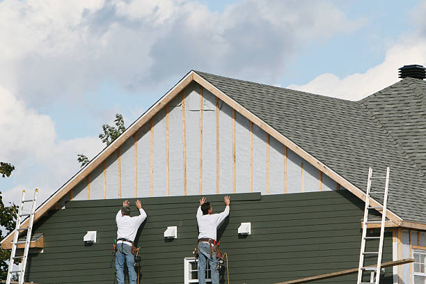 Professional Siding technician working in Huntersville, NC
